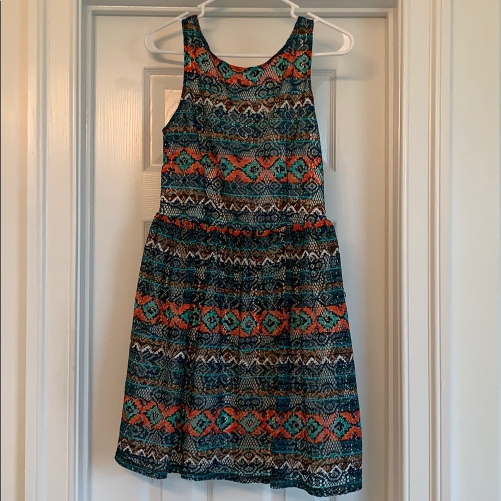 Crochet like patterned short dress.